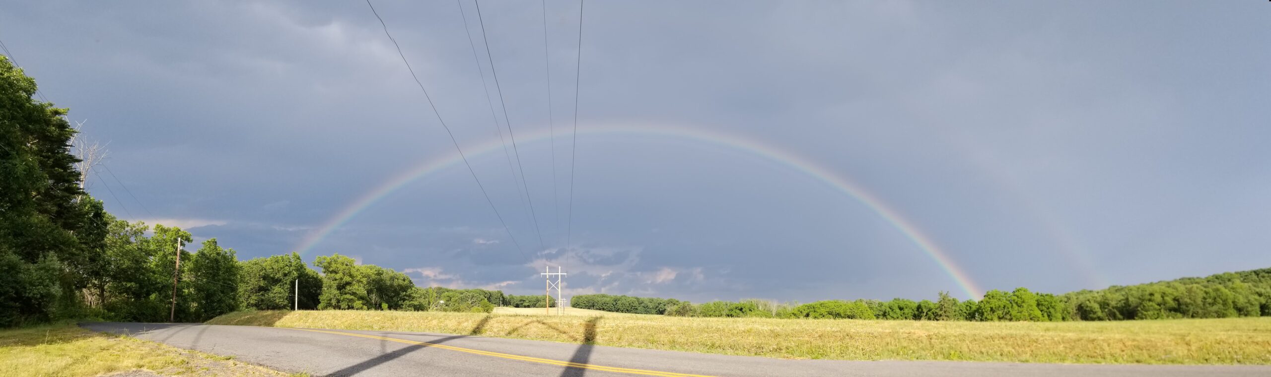 Rainbow after a storm representing hope and healing for caregivers and families